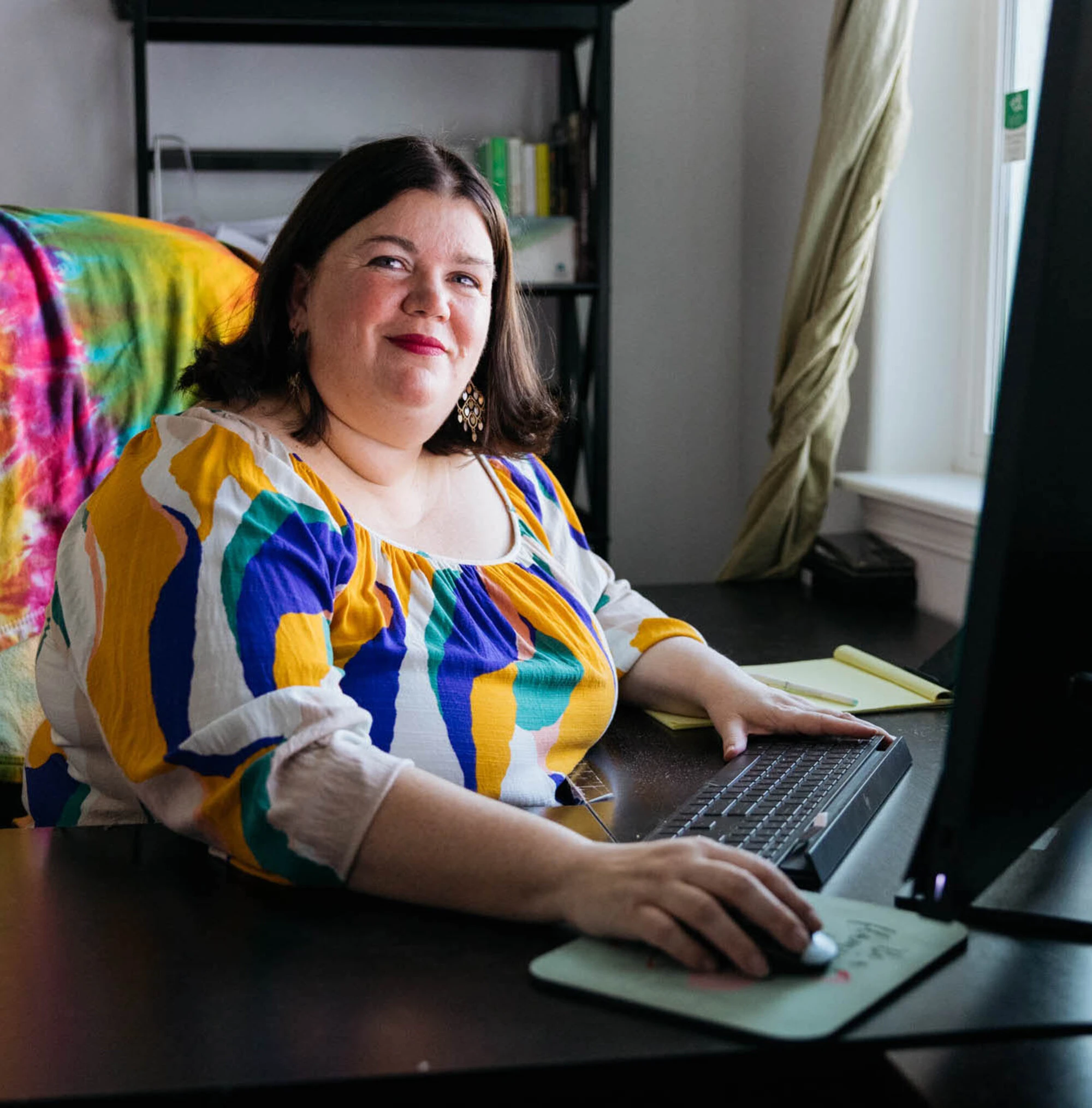 Tammilee working from her computer.